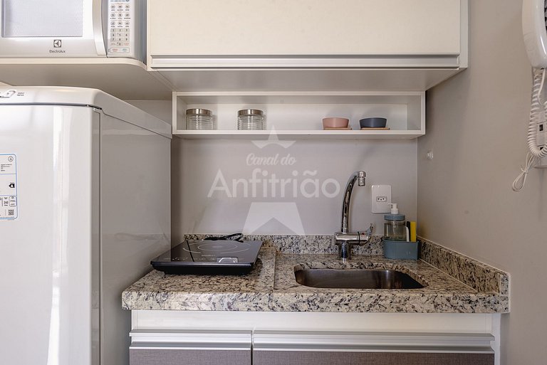 Studio bonitinho com garagem e ar condicionado